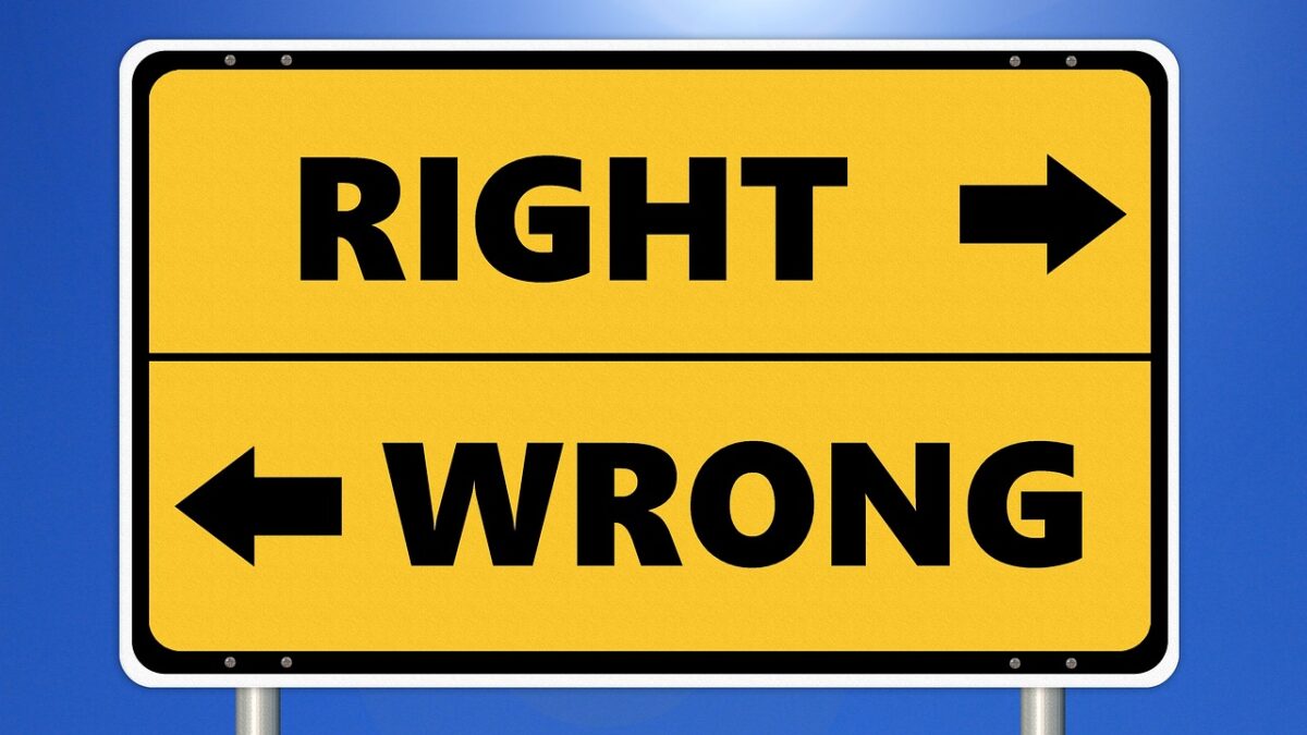 A sign pointing one way fro right and the other for wrong