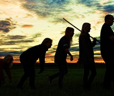 An image of a sky with the shadow of the evolution of humans