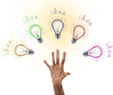 Hand with light bulbs with word ideas