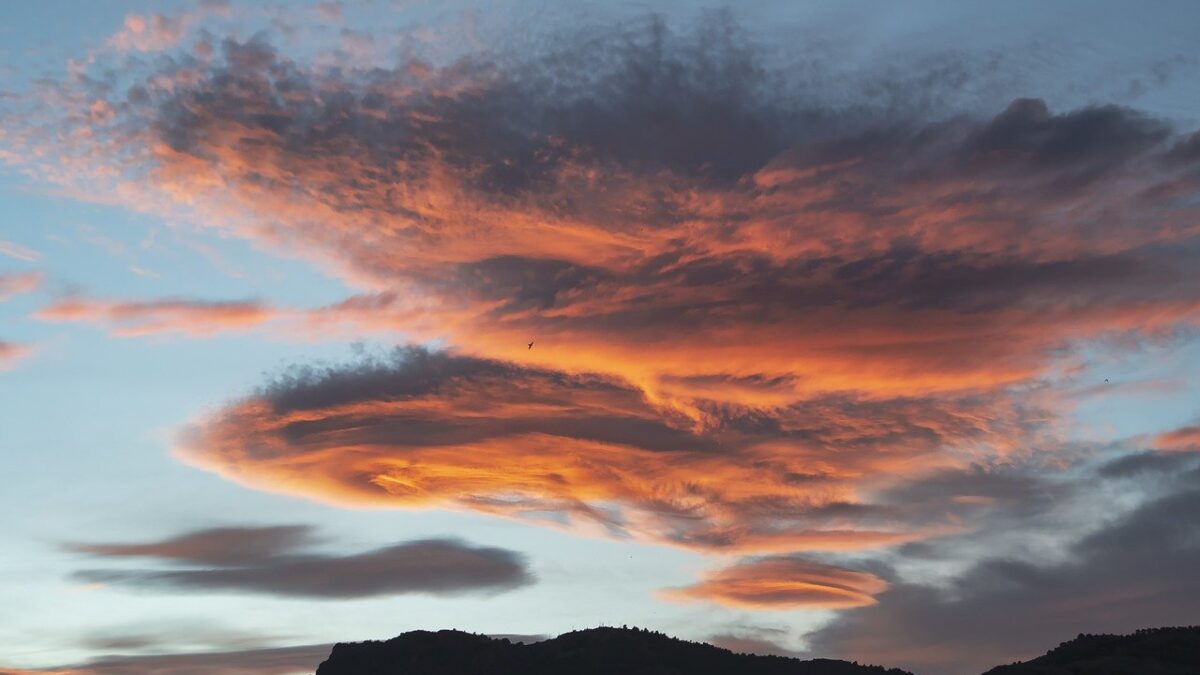 Sunset with clouds and mountains